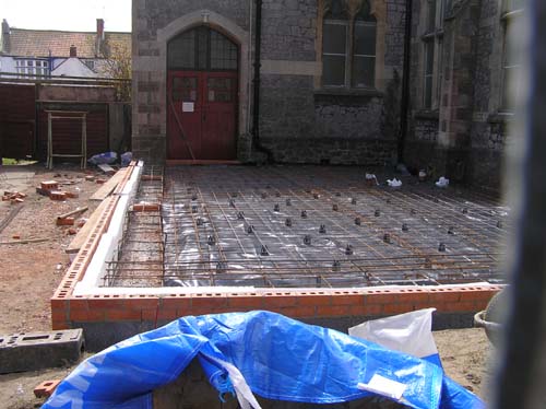 10/4 The steelwork for the floor and the first couple of courses of bricks have been laid.